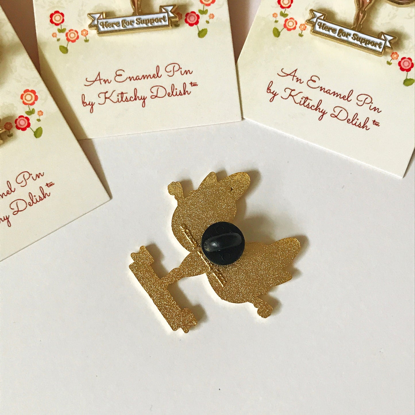 Support, a soft enamel pin with glitter highlights!