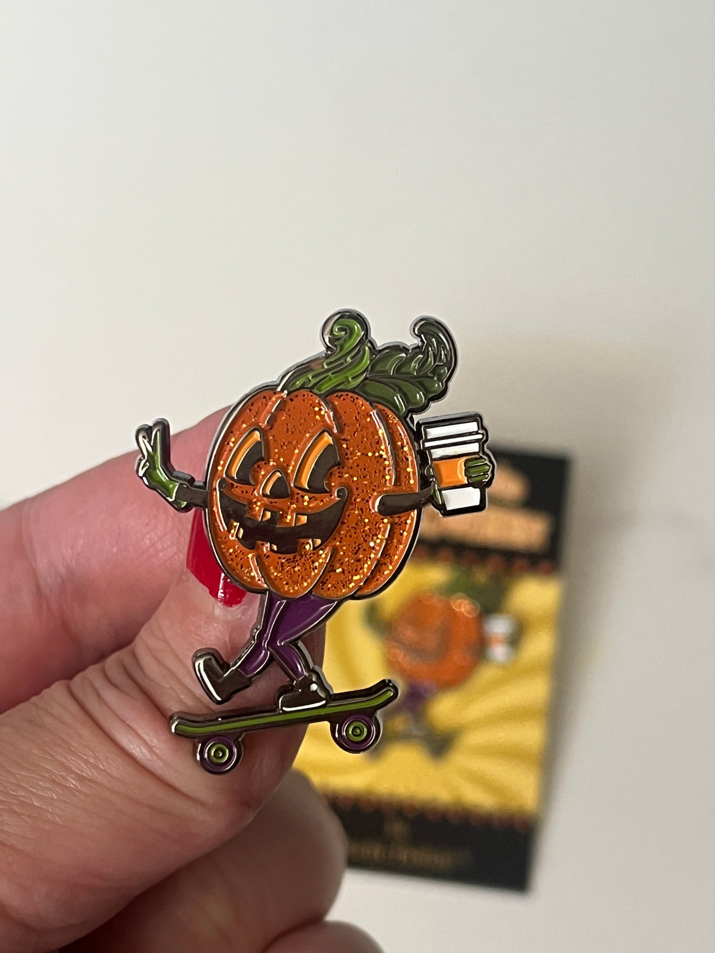 Rolling into Halloween Pumpkin enamel pin with glitter!