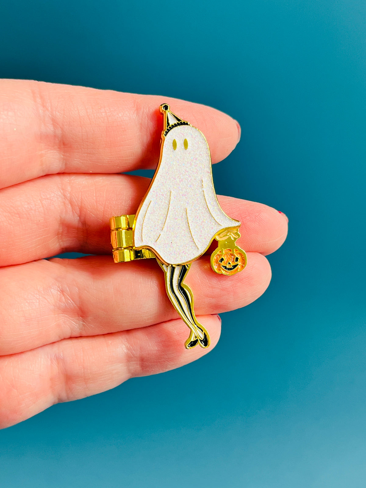The Peek a Boo Pin-up hinge enamel pin