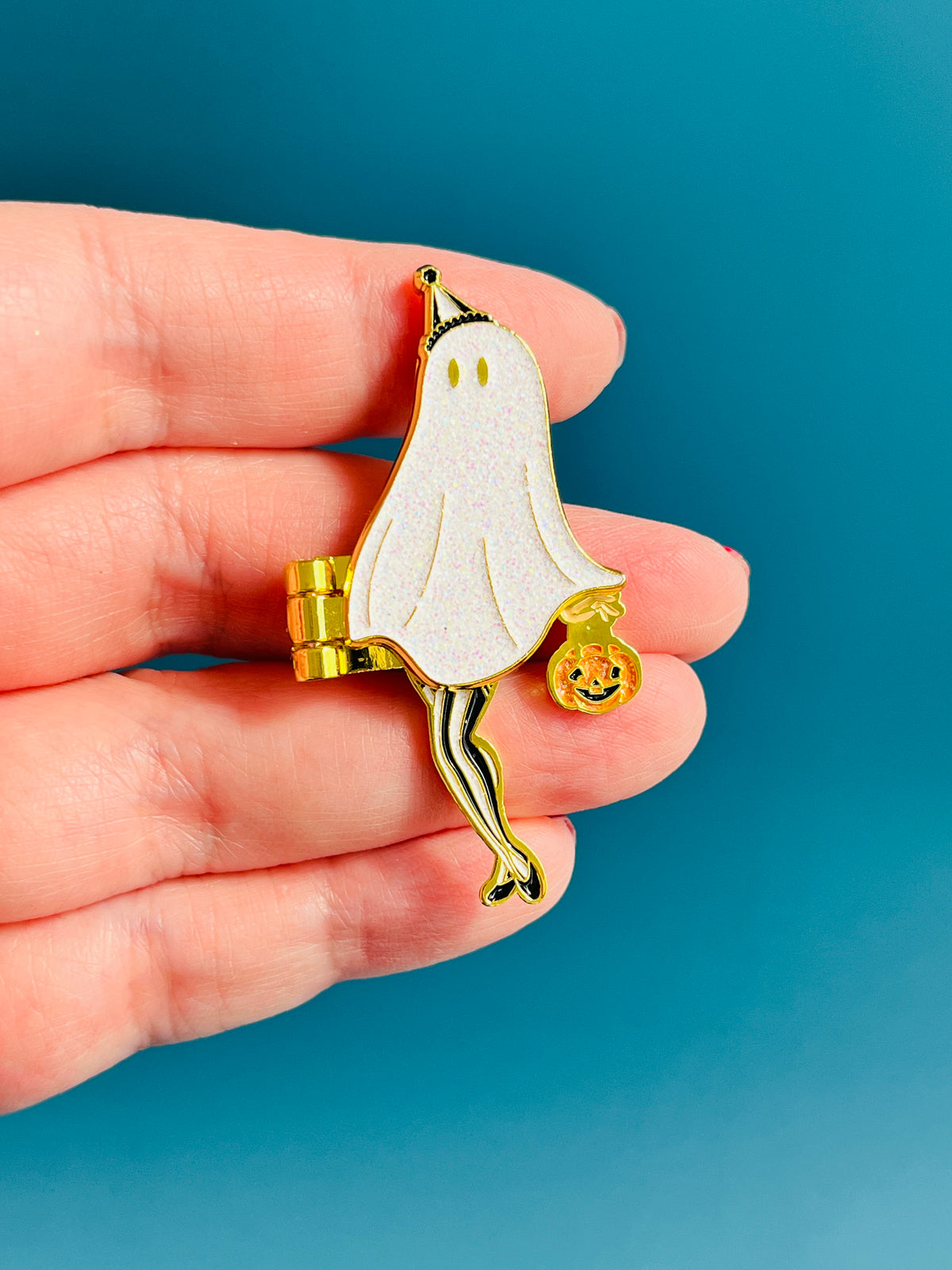 The Peek a Boo Pin-up hinge enamel pin