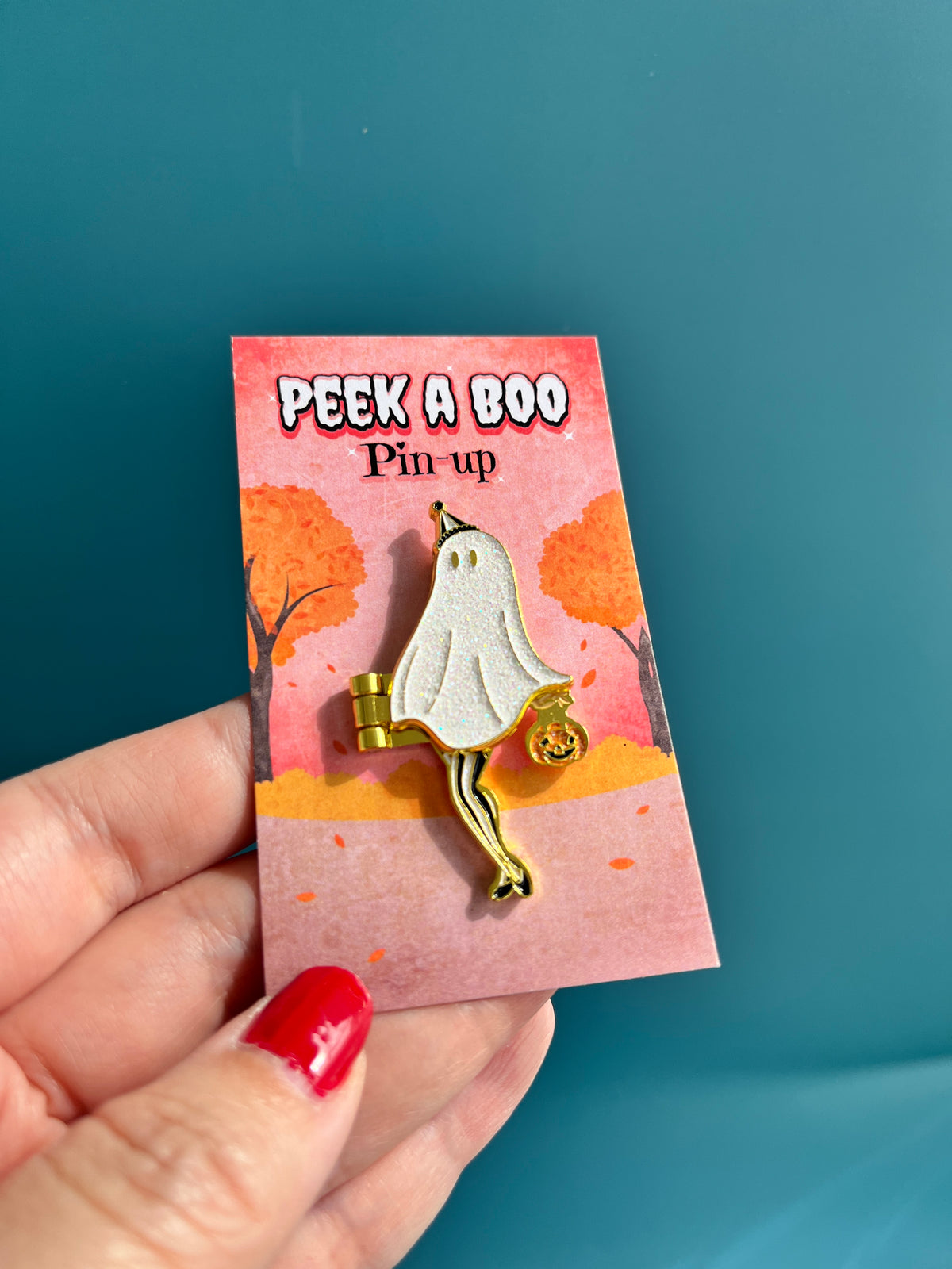 The Peek a Boo Pin-up hinge enamel pin