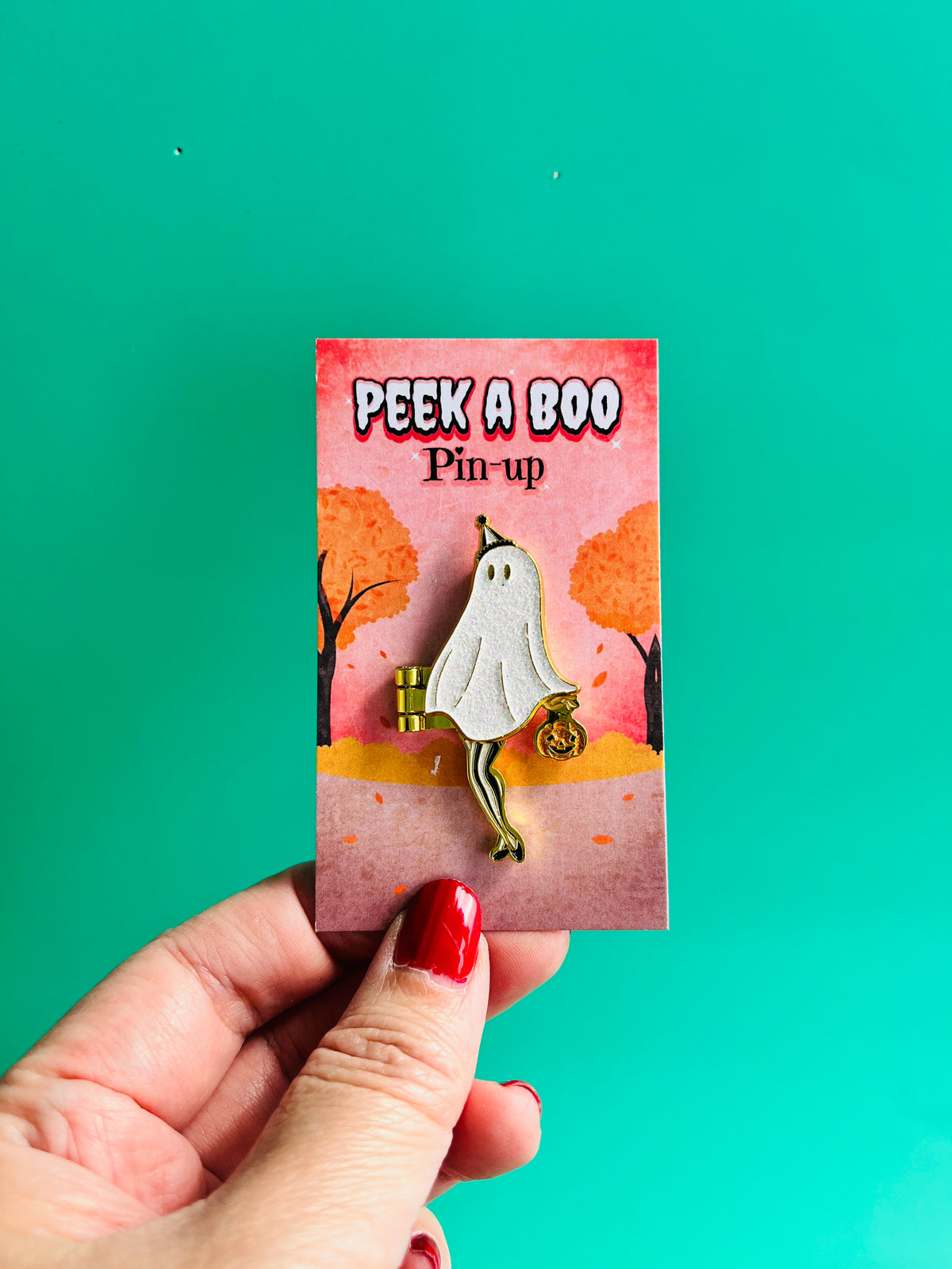 The Peek a Boo Pin-up hinge enamel pin