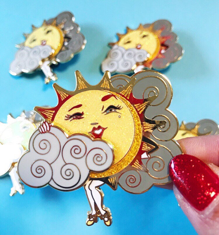 Sliding Cloud Sun Teaser hard enamel pin with glitter!
