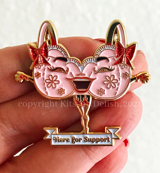 Support, a soft enamel pin with glitter highlights!