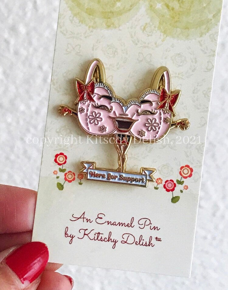 Support, a soft enamel pin with glitter highlights!